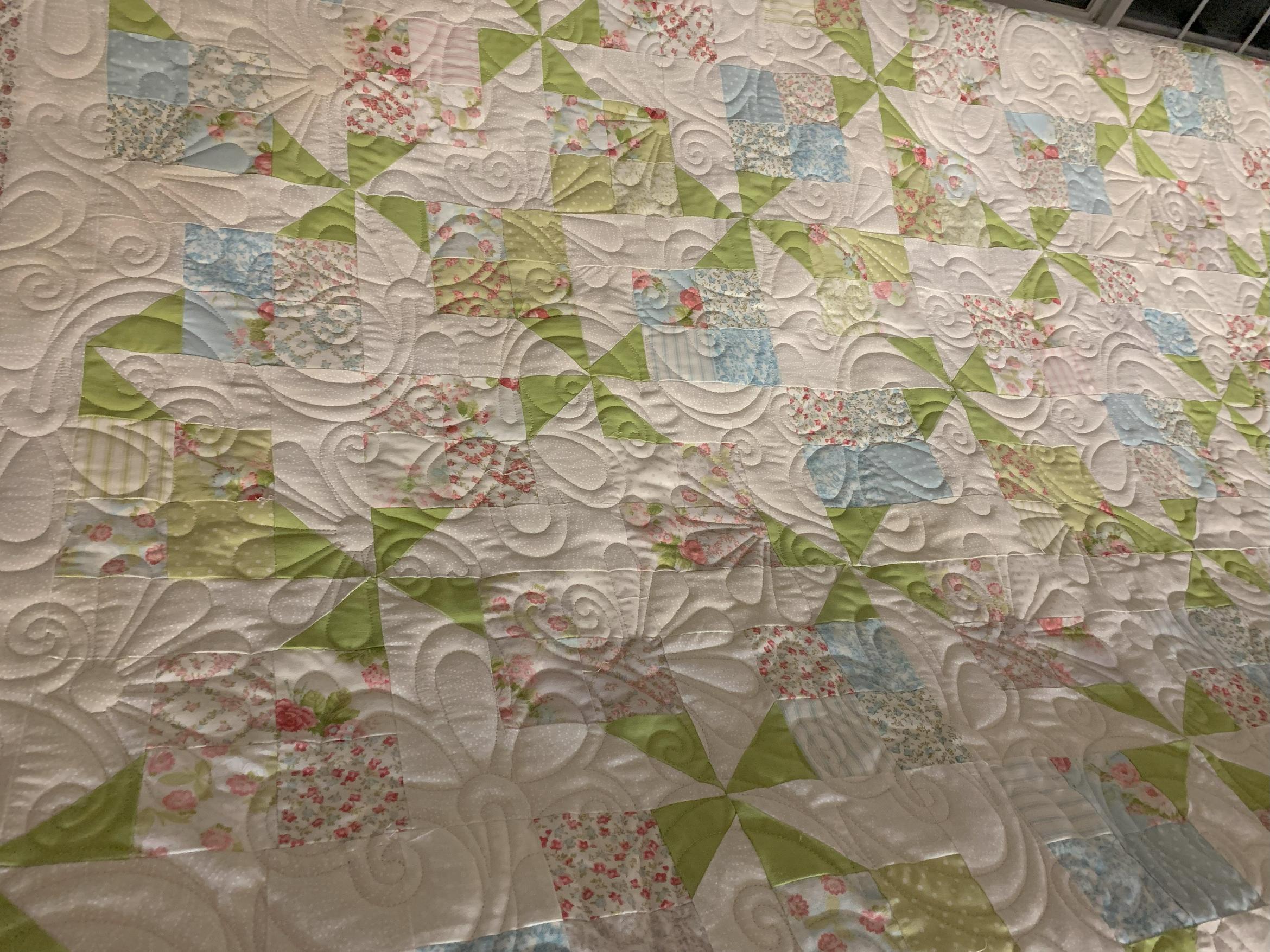 Flowers rise again - pieced by Anna Goduco.